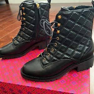 Tory Burch Quilted Combat lug sole boot in black and gold hardwares.